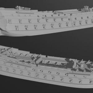 May include: Two detailed, light gray model ships are displayed against a dark background. The ships are multi-decked, with intricate details like cannons, windows, and decorative elements. The image showcases the ships from different angles.