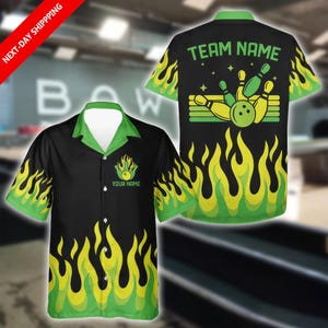 May include: Black bowling shirt with green and yellow flame design. The shirt has a green collar and sleeves. The front of the shirt has a bowling pin and ball graphic with the text "YOUR NAME". The back of the shirt has a bowling pin and ball graphic with the text "TEAM NAME".