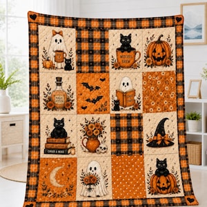 May include: A quilted throw blanket featuring a grid of Halloween-themed squares with orange and black plaid borders. Illustrations include ghosts, black cats, pumpkins, a magic potion bottle, a witch hat, and books labelled Boo & Cozy, Witches Brew, Ghost Stories, and Curses & Hexes.