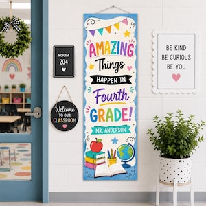 May include: A vertical rectangular classroom banner featuring colorful bunting, stars, and the text "AMAZING Things HAPPEN IN Fourth GRADE! MR. ANDERSON" above illustrations of a red apple, a stack of three books, pencils, and a blue globe.