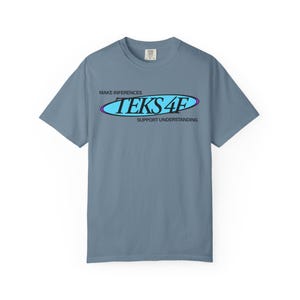 May include: A blue short-sleeve t-shirt with the text "TEKS 4F" in a blue and purple oval design. The shirt also has the phrases "MAKE INFERENCES" and "SUPPORT UNDERSTANDING" printed above and below the oval design.