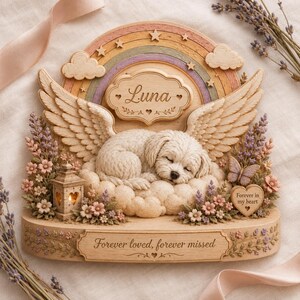 May include: A decorative memorial plaque featuring a sleeping puppy with angel wings resting on clouds. A rainbow with stars arches above, and a plaque reads Luna. The base includes flowers, a lantern, and the text Forever loved, forever missed.