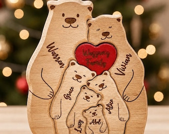 May include: A wooden puzzle featuring a family of six bears. The two large bears are engraved with the names Warren and Vivian. Three smaller bears are engraved with the names Grace, Lucy, and Alice, and the smallest bear is named Abel. A red heart is engraved with the text Wagging Family.