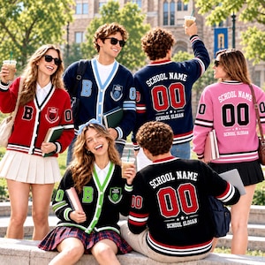May include: A group of people wearing varsity-style cardigans in red, navy blue, black, and pink. The cardigans feature V-necks, button closures, striped cuffs, and text reading SCHOOL NAME, 00, and SCHOOL SLOGAN on the backs and fronts.