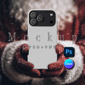 May include: A light gray phone case with a black camera module is held in red mittens. The word "Mockup" is displayed in silver letters, with "PSD + PNG" below. Icons for Photoshop and Canva are also visible.