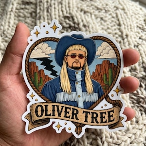 May include: A die-cut sticker featuring a portrait of a person with long blonde hair and a mullet wearing a blue cowboy hat, sunglasses, and a blue fringed jacket. The background shows a desert landscape with cacti, a lightning bolt, and a rope border. A banner at the bottom displays the text OLIVER TREE.