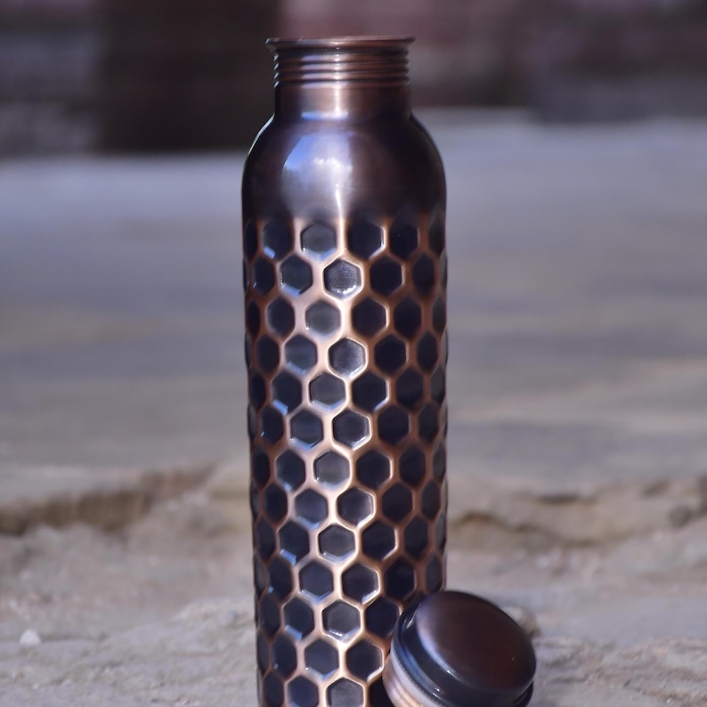 Handmade honeycomb copper water bottle 34oz"

"Pure copper bottle with honeycomb engraved design"

"Luxury handcrafted copper water bottle Ayurvedic"