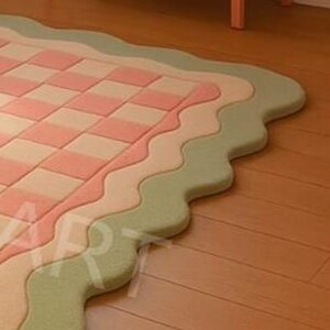 Aesthetic checkerboard area rug placed near sofa in stylish room