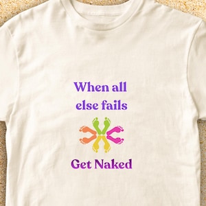 May include: A white t-shirt with the text "When all else fails Get Naked" in purple. The shirt features a colorful design of footprints in a circular pattern, with green, orange, yellow, and pink feet.