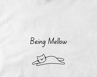 Being mellow cat tee for lounging relaxing fun. Short sleeved 100% cotton classic casual shirt. Unisex classic T-shirt. Sustainable tshirt.