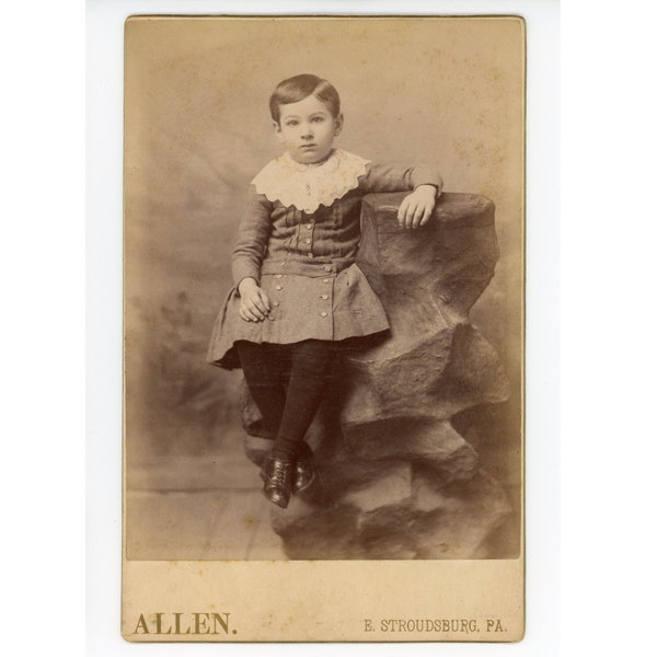 Antique Cabinet Card Photo of boy in skirt, circa 1880s-1890s. Studio Photograph from E. Stroudsburg, Pennsylvania. Victorian fashion child