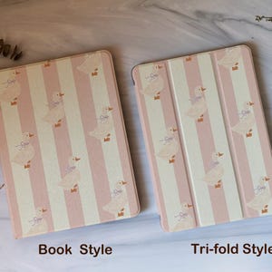 May include: Two tablet cases, one in a book style and the other a tri-fold style, are displayed. Both cases feature a repeating pattern of pink and white vertical stripes with illustrations of ducks. The text "Book Style" and "Tri-fold Style" are visible.