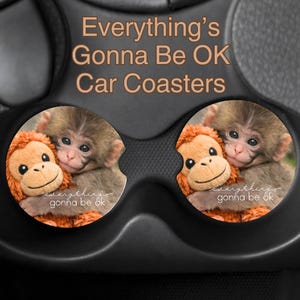 May include: A set of three ceramic mugs with a speckled, matte finish. The mugs are in shades of cream, light gray, and dark gray. Each mug has a simple, minimalist design and a rounded handle.