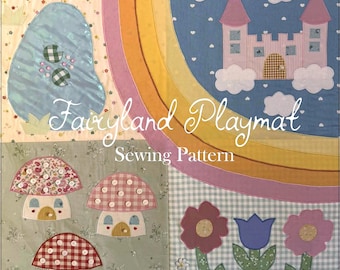 May include: A colorful, patchwork playmat with a fairy tale theme. The design includes a rainbow, castle, mushrooms, flowers, and a pond. The text "Fairyland Playmat Sewing Pattern" is displayed in a whimsical font.