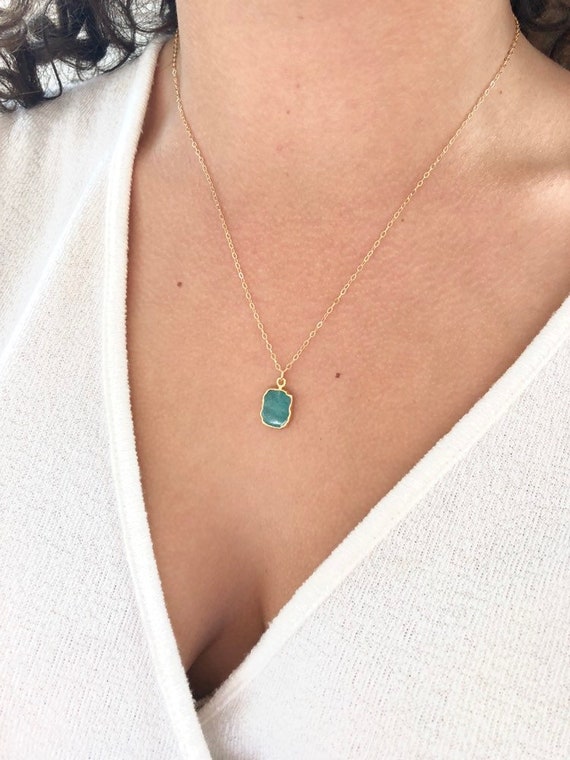 Gold necklace with shop emerald pendant
