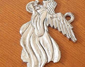May include: A silver angel ornament with wings outstretched and a flowing robe. The angel is holding a small object in its hand.