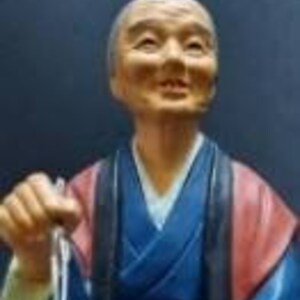 Japanese Hakata Urusaki figurine clay doll holding chop sticks vintage Buddhist offering