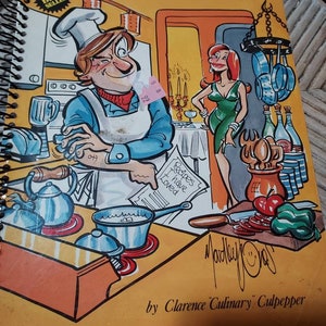 May include: A yellow cookbook with a cartoon illustration of a chef cooking in a kitchen. The book is titled "The Bachelor's Guide to Ward Off Starvation" and is labeled "National Best Seller".