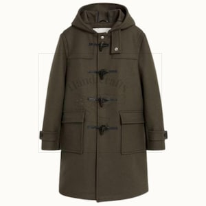 May include: Olive green duffel coat with a hood, toggle closures, and two front pockets. The coat has long sleeves with buttoned cuffs. A classic outerwear garment.