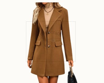 May include: A brown, knee-length coat with a notched lapel, two front pockets, and two buttons. The coat is worn over a beige turtleneck and a gold necklace. A black purse with a gold chain is held in the hand.