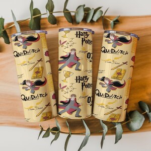 May include: Three yellow insulated tumblers with a Harry Potter theme. Each tumbler features the words "Quidditch" and "Harry Potter" along with illustrations of Harry Potter, a golden snitch, a book, and a sword.