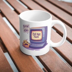 May include: White ceramic mug featuring a cartoon illustration. The design includes a retro computer with the text "Chill Not Found" on the screen, and a sad-faced character. The mug also has the text "Error 404:" in a speech bubble.