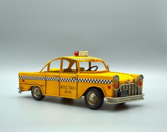 Vintage NYC Taxi Model Car: Retro Yellow Cab Collectible Metal Decor