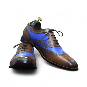 Front view of handmade brown & blue leather lace-up wingtip brogue shoes, perfect for formal occasions.