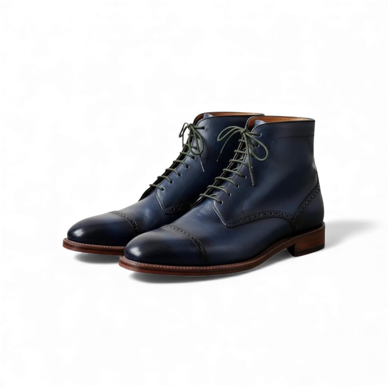 Side angle of elegant blue brogue boots, perfect for a wedding.