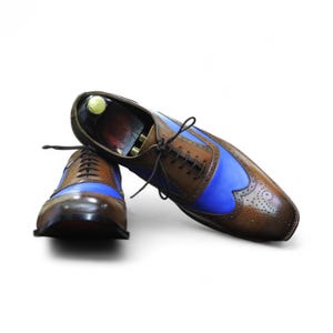 Front view of handmade brown & blue leather lace-up wingtip brogue shoes, perfect for formal occasions.