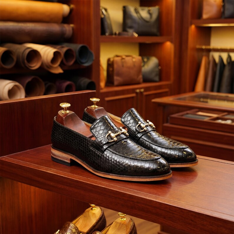 Studio shot of black texture leather loafers with shoe trees