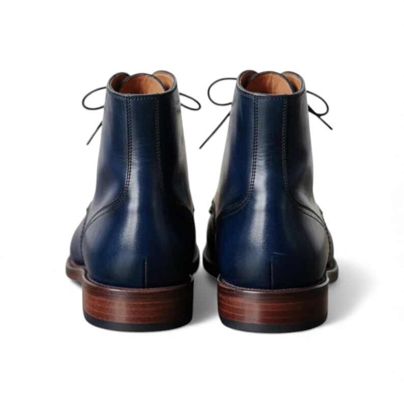 Rear view showcasing dark blue full grain leather formal men's boots.