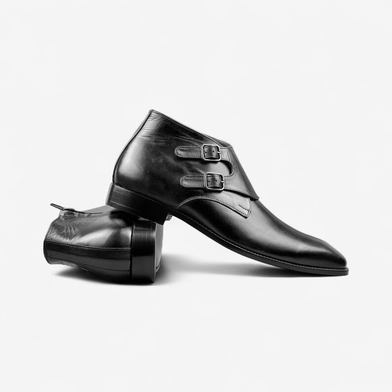 Lifestyle shot of brown or black leather double monk strap boots styled for business events and casual settings.
