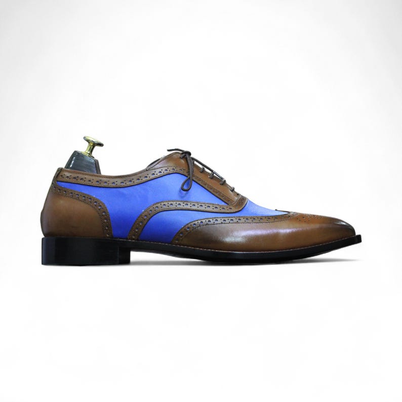 Side view highlighting the intricate brogue detailing and premium leather craftsmanship.