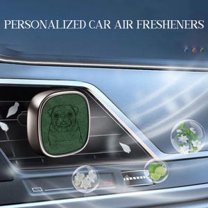 May include: A silver-toned car air freshener vent clip featuring a dark green square insert with a line-art illustration of a pug dog. The text PERSONALIZED CAR AIR FRESHENERS appears at the top, accompanied by floating bubbles of white flowers and lime slices.