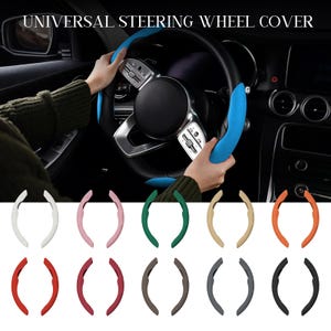 May include: A black steering wheel with a blue cover is shown, with the text "UNIVERSAL STEERING WHEEL COVER" at the top. Below are various colored steering wheel covers in white, pink, green, tan, orange, red, burgundy, brown, gray, and black.