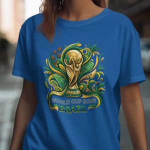 Blue t-shirt with FIFA World Cup 2026 Brazil trophy graphic.
