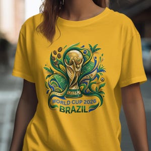 Yellow t-shirt with FIFA World Cup 2026 Brazil trophy graphic.