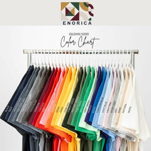 May include: A set of three ceramic mugs with a speckled, matte finish in cream, light grey, and dark grey. Each mug has a simple, minimalist design, ideal for coffee or tea.