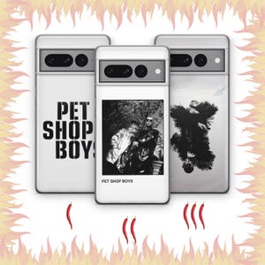 May include: Three white phone cases with various designs. One case displays the text "PET SHOP BOYS" in black. Another features a black and white photo of two people. The third case has a black and white image of a person. Red chilli peppers and a flame design surround the cases.