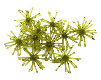 May include: A collection of translucent chartreuse fishing lures, each featuring a central core with numerous radiating, thin, flexible appendages speckled with small black dots, designed to mimic aquatic organisms for angling.