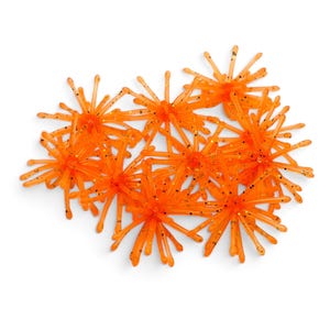May include: A collection of bright orange, star-shaped fishing lures made of soft, translucent plastic. Each lure features multiple radiating, flexible arms and is embedded with small, reflective gold glitter particles throughout the material.