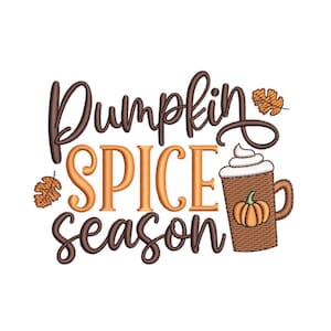 May include: An embroidery design featuring the text Pumpkin SPICE season in dark brown and orange thread. A brown mug with a small orange pumpkin graphic and white whipped cream sits to the right, accompanied by two small orange autumn leaves.