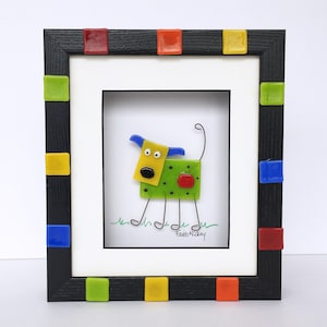Whimsical bright fused glass dog picture in shadowbox frame with stainless steel legs and tail