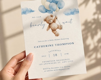 Puede incluir: Una tarjeta de invitación rectangular para baby shower con una ilustración en acuarela de un oso de peluche marrón que sostiene un grupo de globos azules y crema. El texto dice: WE CAN bearly WAIT, Join us for a Baby Shower honoring CATHERINE THOMPSON.