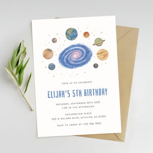 May include: A birthday invitation with a space theme. The invitation features a watercolour illustration of planets and a galaxy. The text reads "Elijah's 5th Birthday" with event details. Includes a kraft paper envelope and a sprig of greenery.