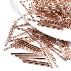 Koraliki szklane trąbkowe 30 mm: metaliczne różowe złoto 20 g