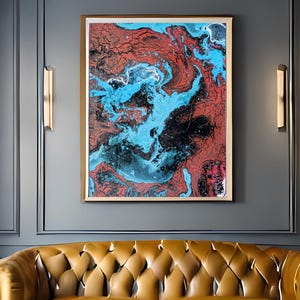 May include: An abstract painting with a swirling pattern of red, blue, and black colors, framed in a gold frame. The artwork hangs above a tufted, mustard-colored leather sofa. The room has dark gray walls and a white patterned rug.