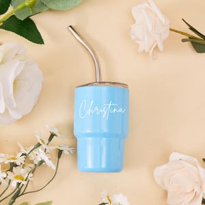 May include: A set of three ceramic mugs with a speckled, matte finish. The mugs are in shades of cream, light gray, and dark gray. Each mug has a simple, minimalist design, perfect for coffee or tea.