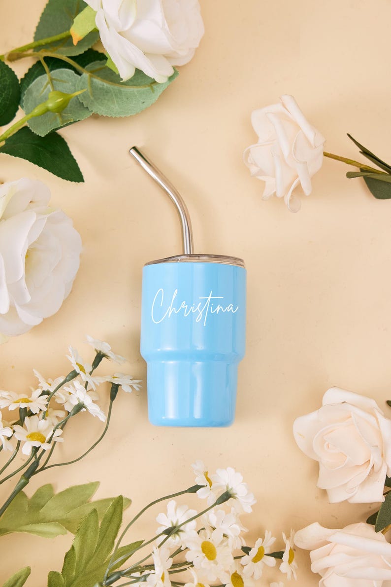 May include: A set of three ceramic mugs with a speckled, matte finish. The mugs are in shades of cream, light gray, and dark gray. Each mug has a simple, minimalist design, perfect for coffee or tea.